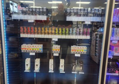 a glass display case with many different types of e-liquids